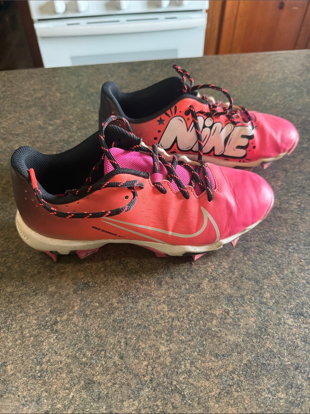 Nike Kids Pink and Black Softball Cleats with Graphic Logo